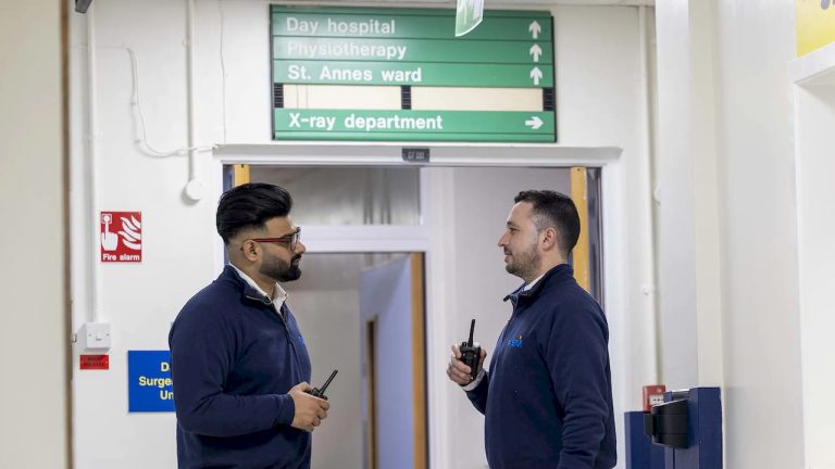 Facilities manager reviewing hospital systems in control room