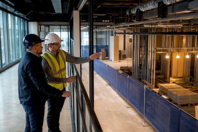Facilities manager inspecting segregated refurbishment area